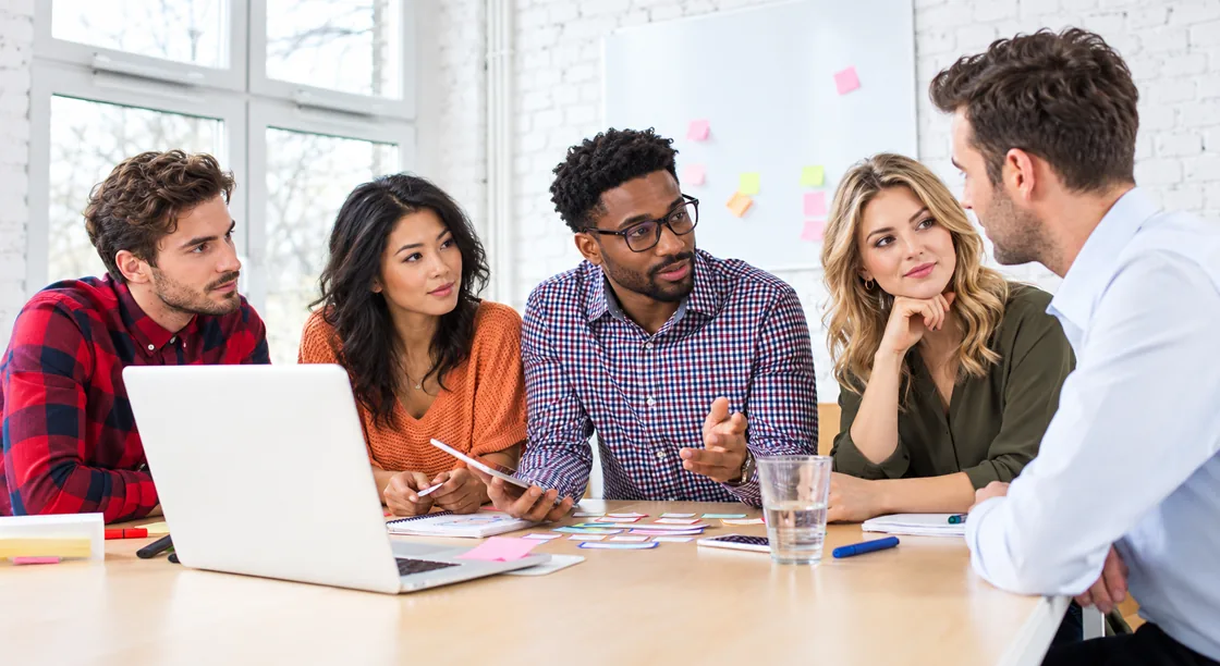 The digiaxo team collaborating around a table